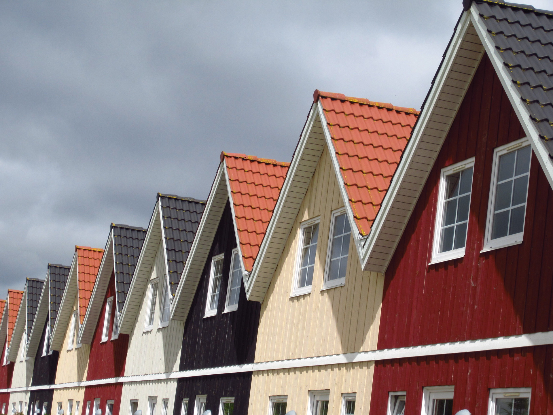 Wooden houses, colourful, arranged in a row