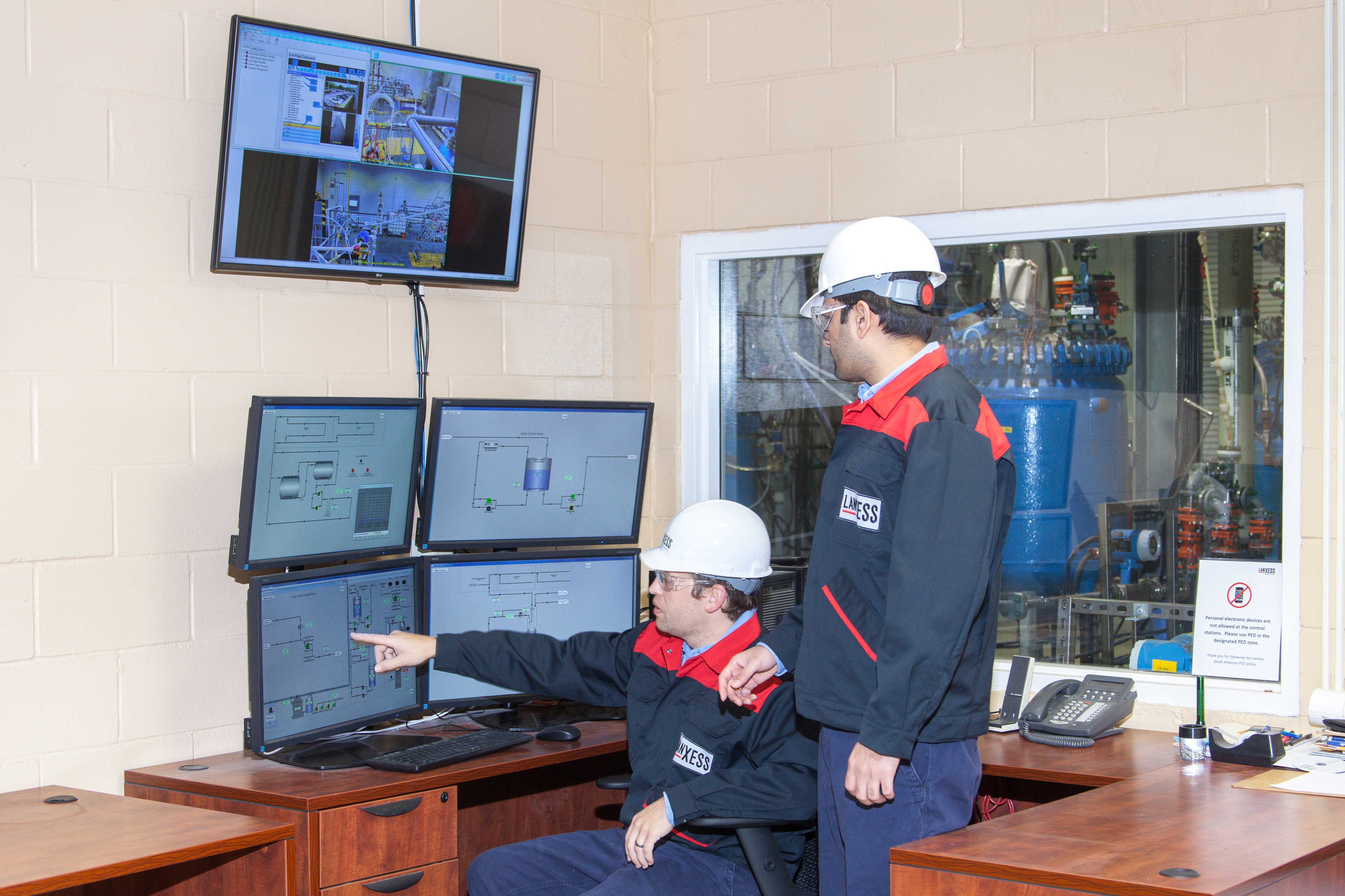 technician and an engineer monitor a in the pilot plant